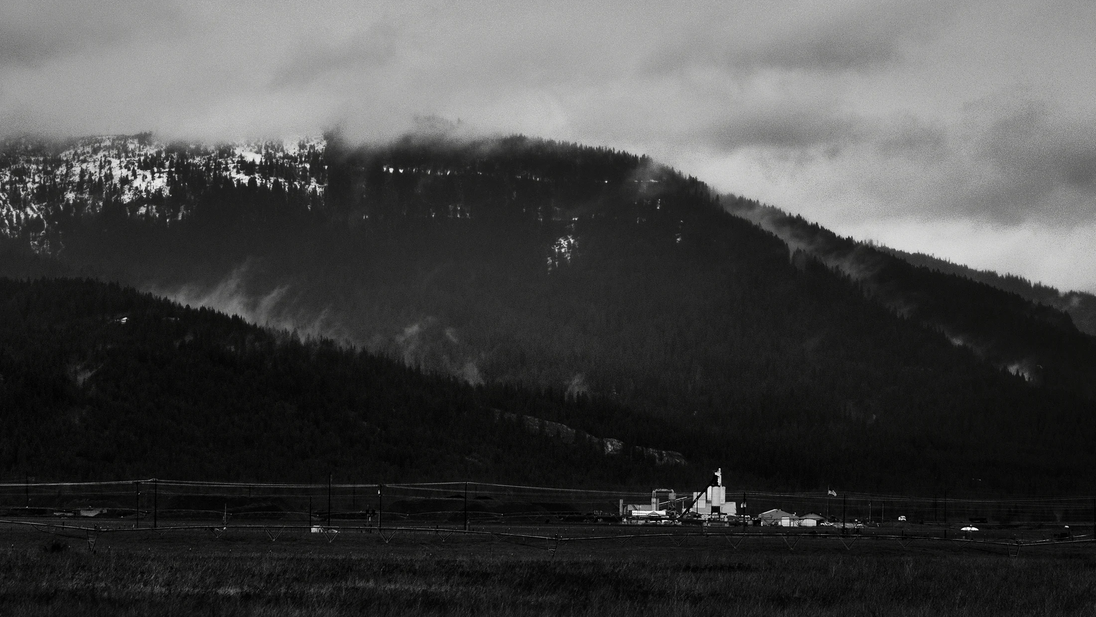 Mountains beneath a cloudy sky